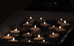 Memorial candles lit during Machar's Nizkor service